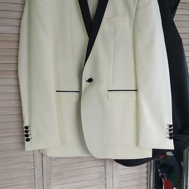 White dinner jacket on a hanger
